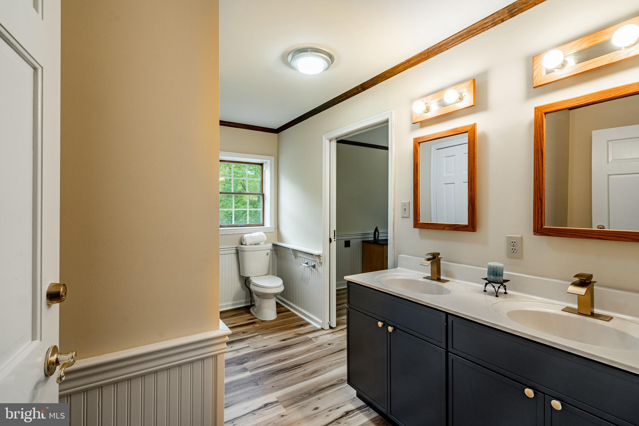 249 Mattson Road Garnet Valley, PA 19060 - Photo 20 of 53 a spacious bathroom with a double vanity sink toilet and a mirror