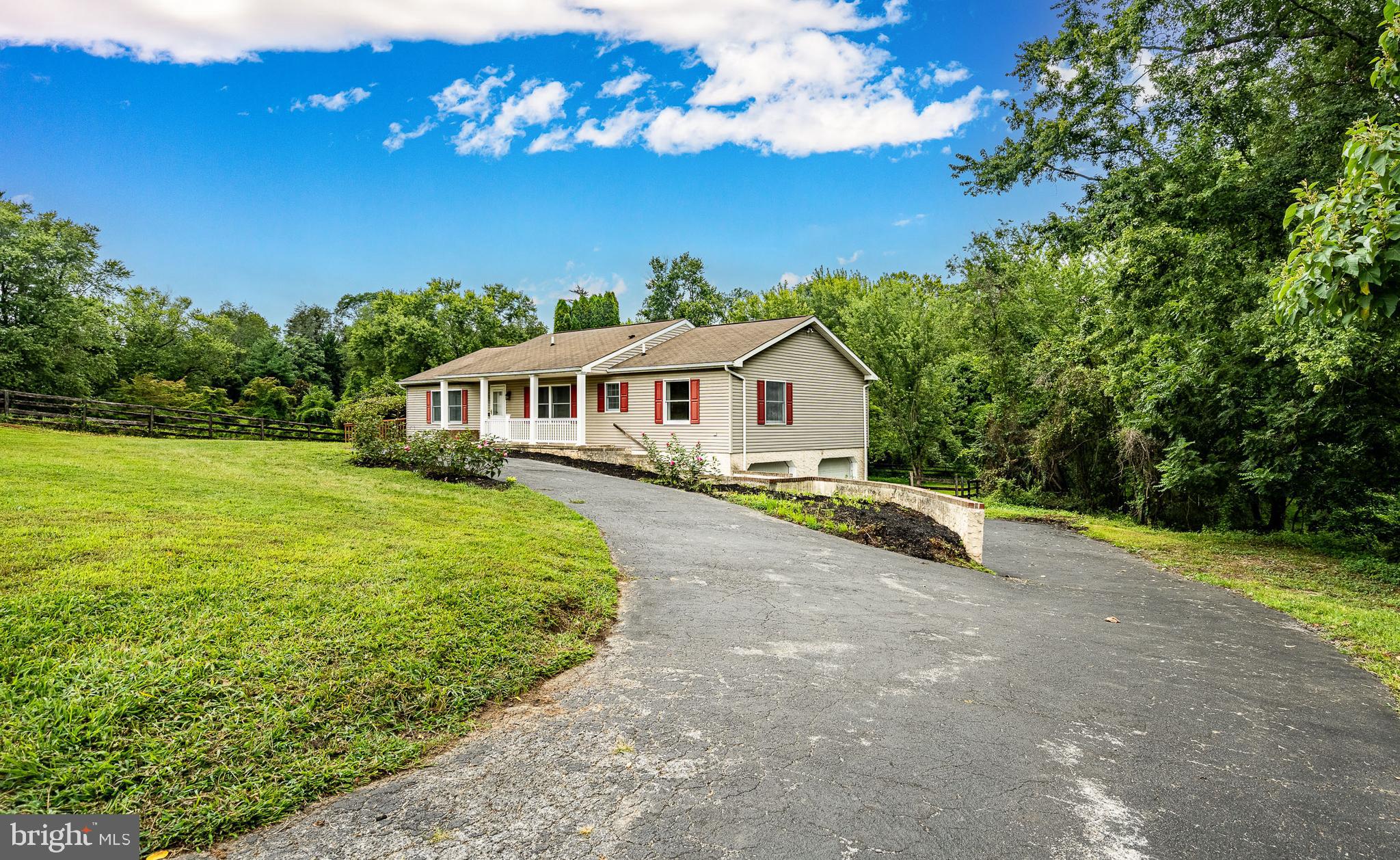 249 Mattson Road Garnet Valley, PA 19060 - Photo 2 of 53 a front view of a house with garden