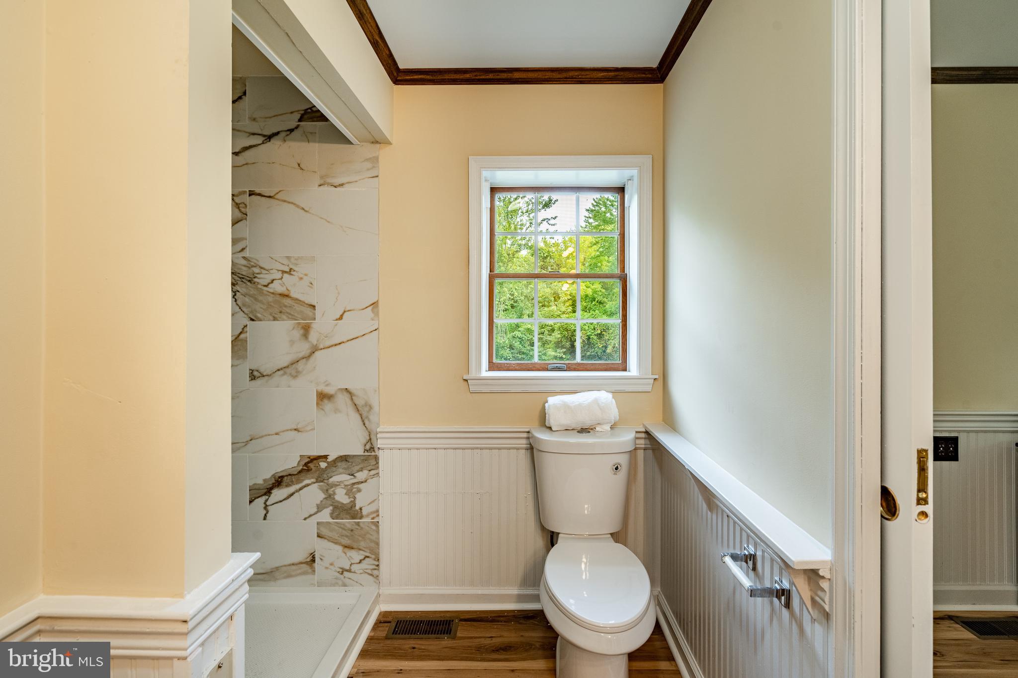 249 Mattson Road Garnet Valley, PA 19060 - Photo 24 of 53 a white toilet sitting next to a bathroom sink and vanity