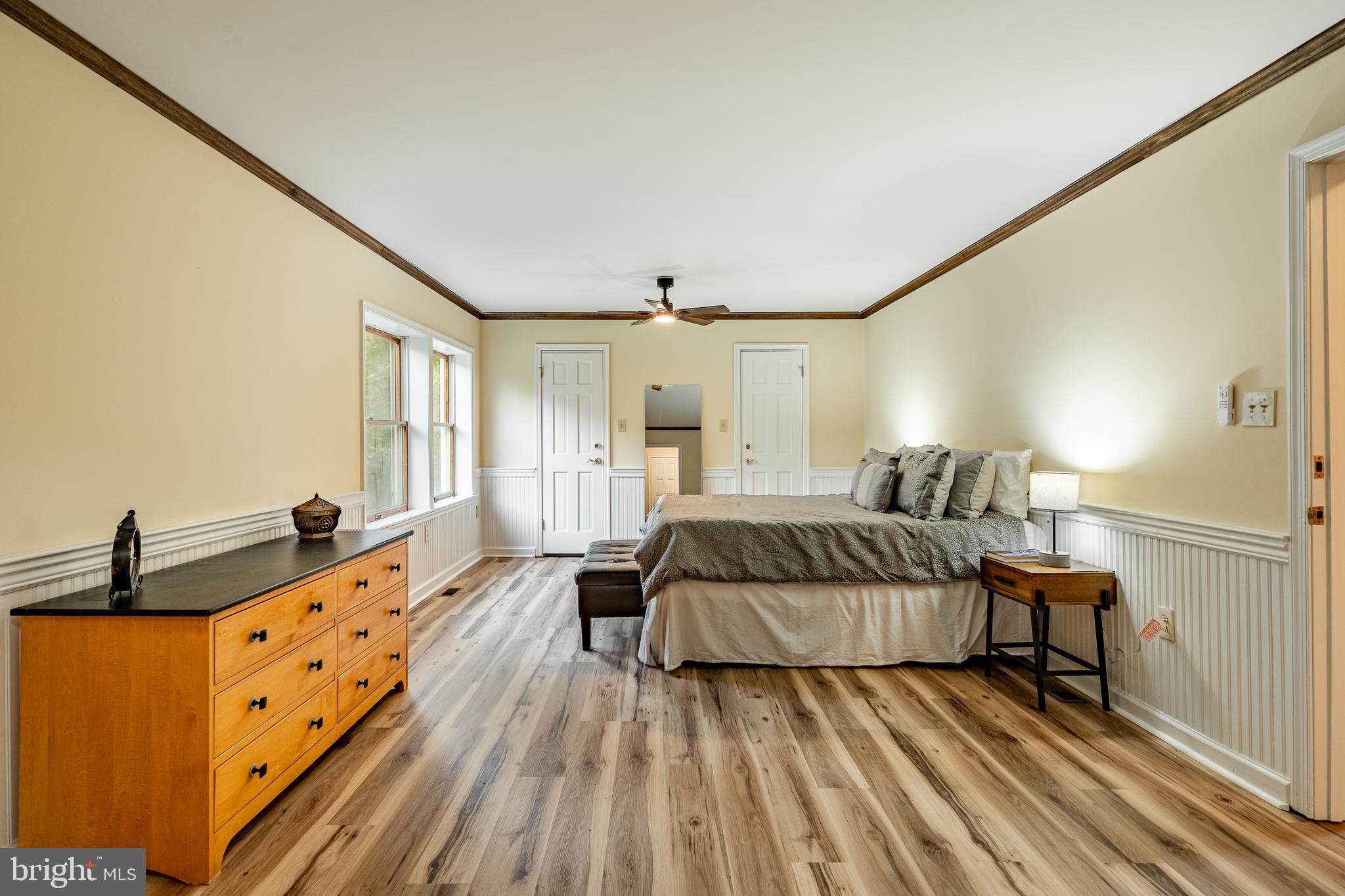 249 Mattson Road Garnet Valley, PA 19060 - Photo 25 of 53 a spacious bedroom with a bed and wooden floor
