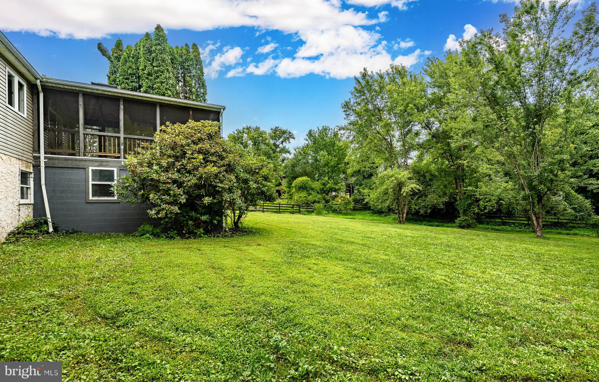 249 Mattson Road Garnet Valley, PA 19060 - Photo 32 of 53 a view of a backyard with potted plants and large tree