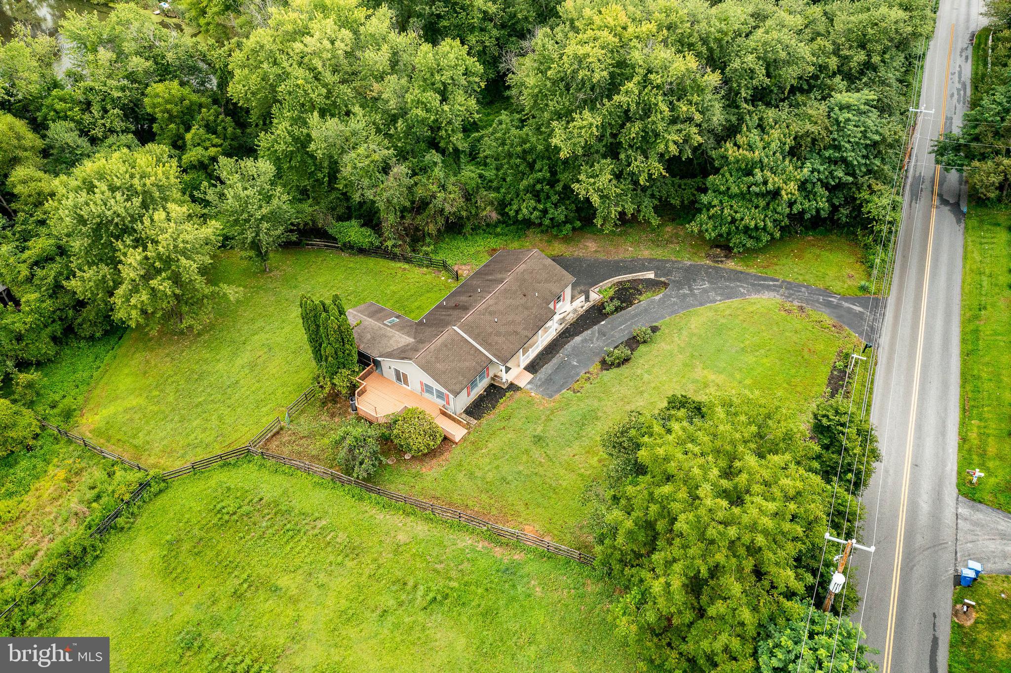 249 Mattson Road Garnet Valley, PA 19060 - Photo 41 of 53 an aerial view of a swimming pool with lawn chairs and plants