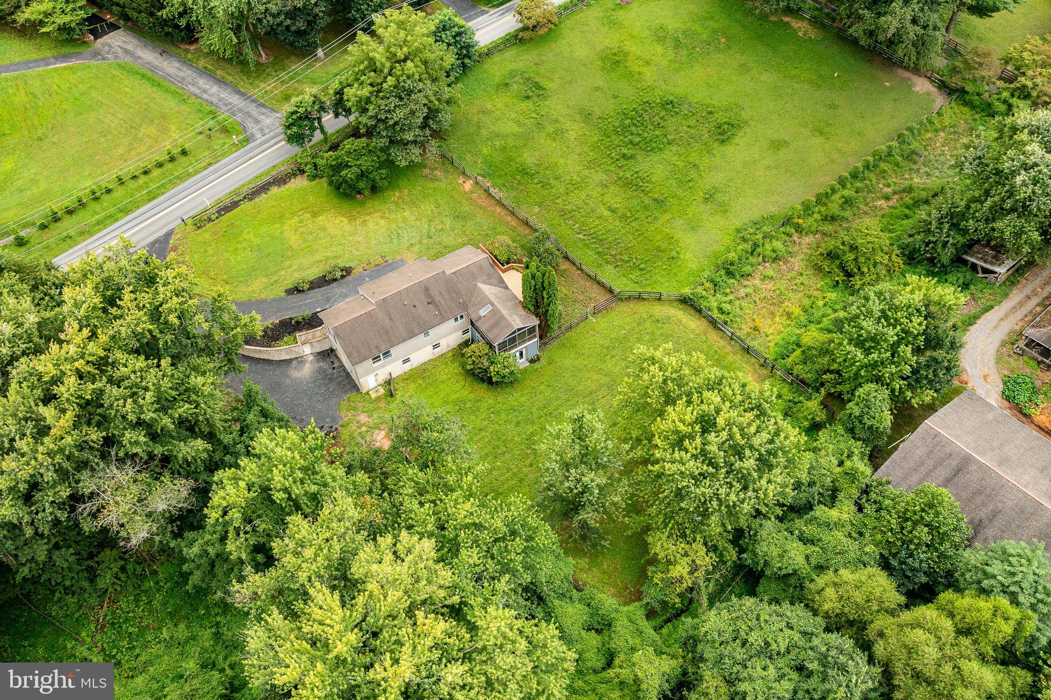 249 Mattson Road Garnet Valley, PA 19060 - Photo 44 of 53 an aerial view of a house with a yard swimming pool outdoor seating and yard