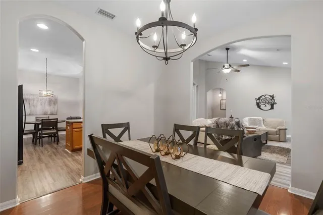 a kitchen with granite countertop a sink stove and cabinets