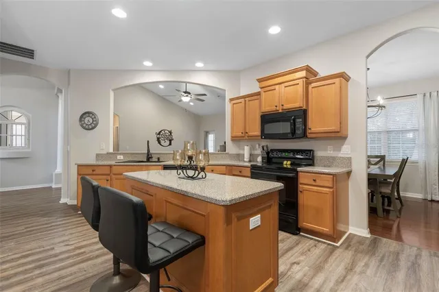 a view of a dining room with furniture wooden floor and chandelier