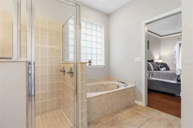 a bedroom with furniture and a window