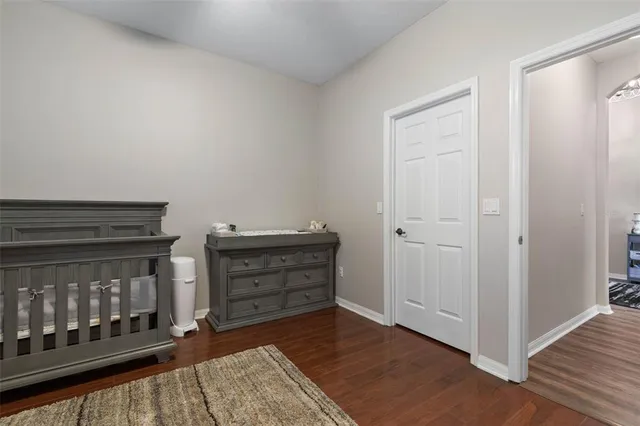 a view of workspace with wooden floor windows