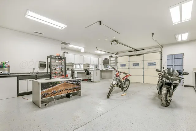 a view of a patio with table and chairs