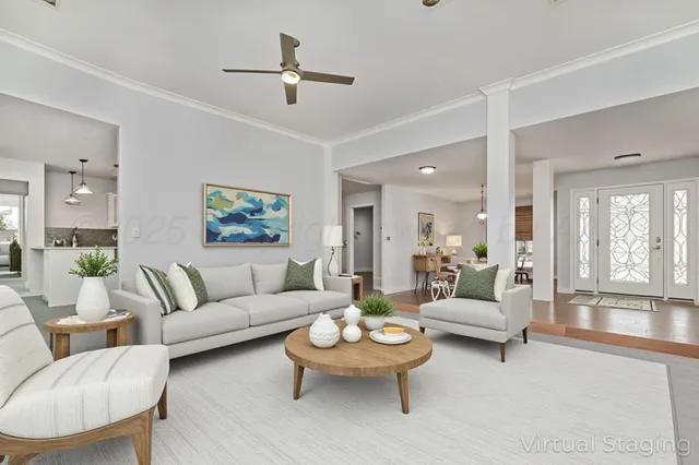 a living room with furniture and a large window