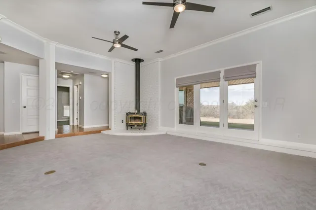 a view of an empty room with a window