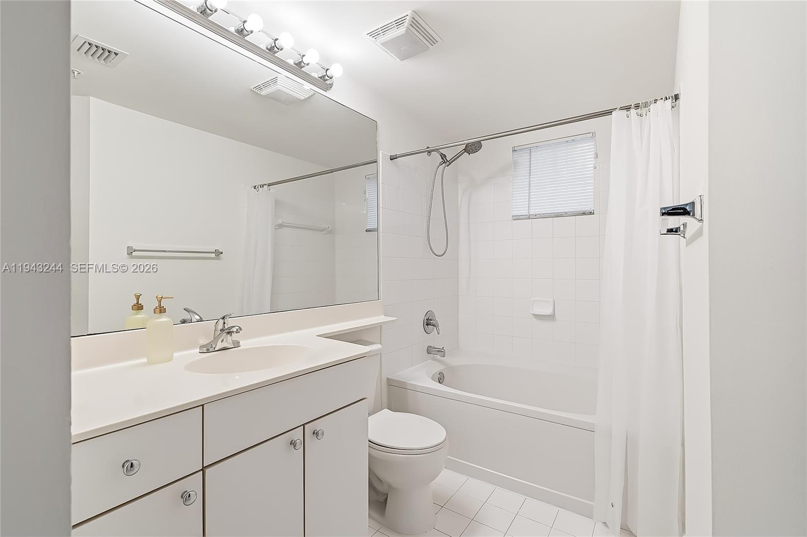17150 North Bay Road, Unit 2301 Sunny Isles Beach, FL 33160 - Photo 16 of 44 a bathroom with a sink a toilet and shower