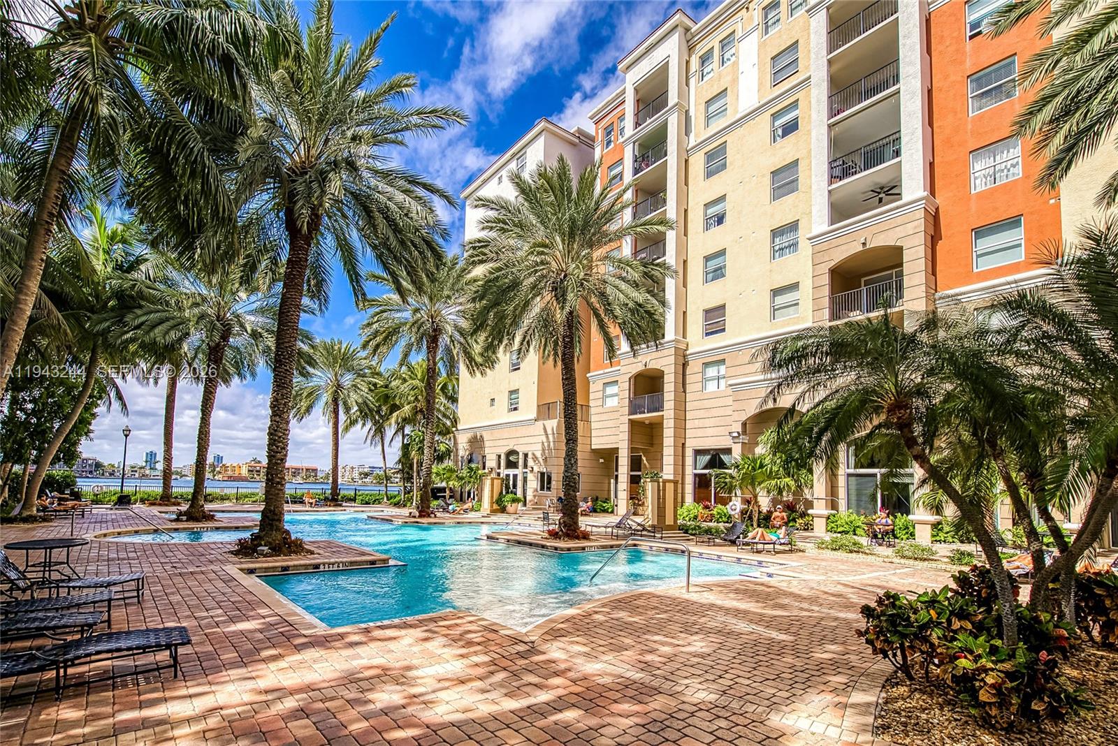 17150 North Bay Road, Unit 2301 Sunny Isles Beach, FL 33160 - Photo 24 of 44 front view of a building with a lots of palm trees