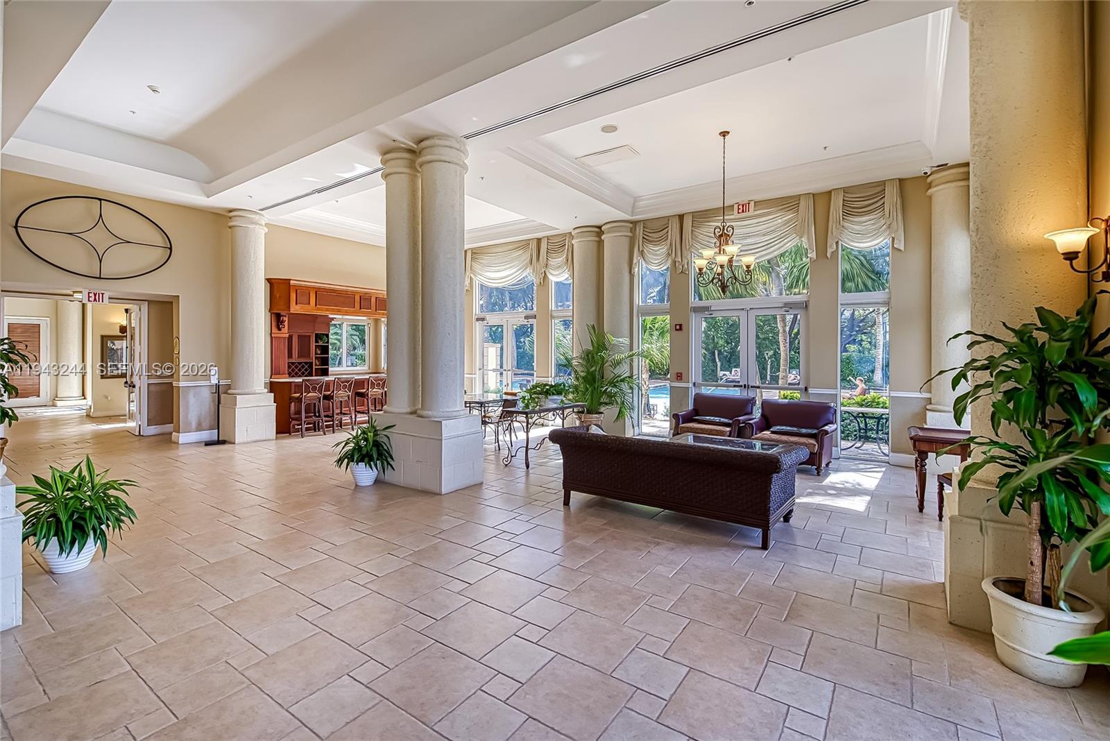 17150 North Bay Road, Unit 2301 Sunny Isles Beach, FL 33160 - Photo 30 of 44 a living room with furniture and a large window