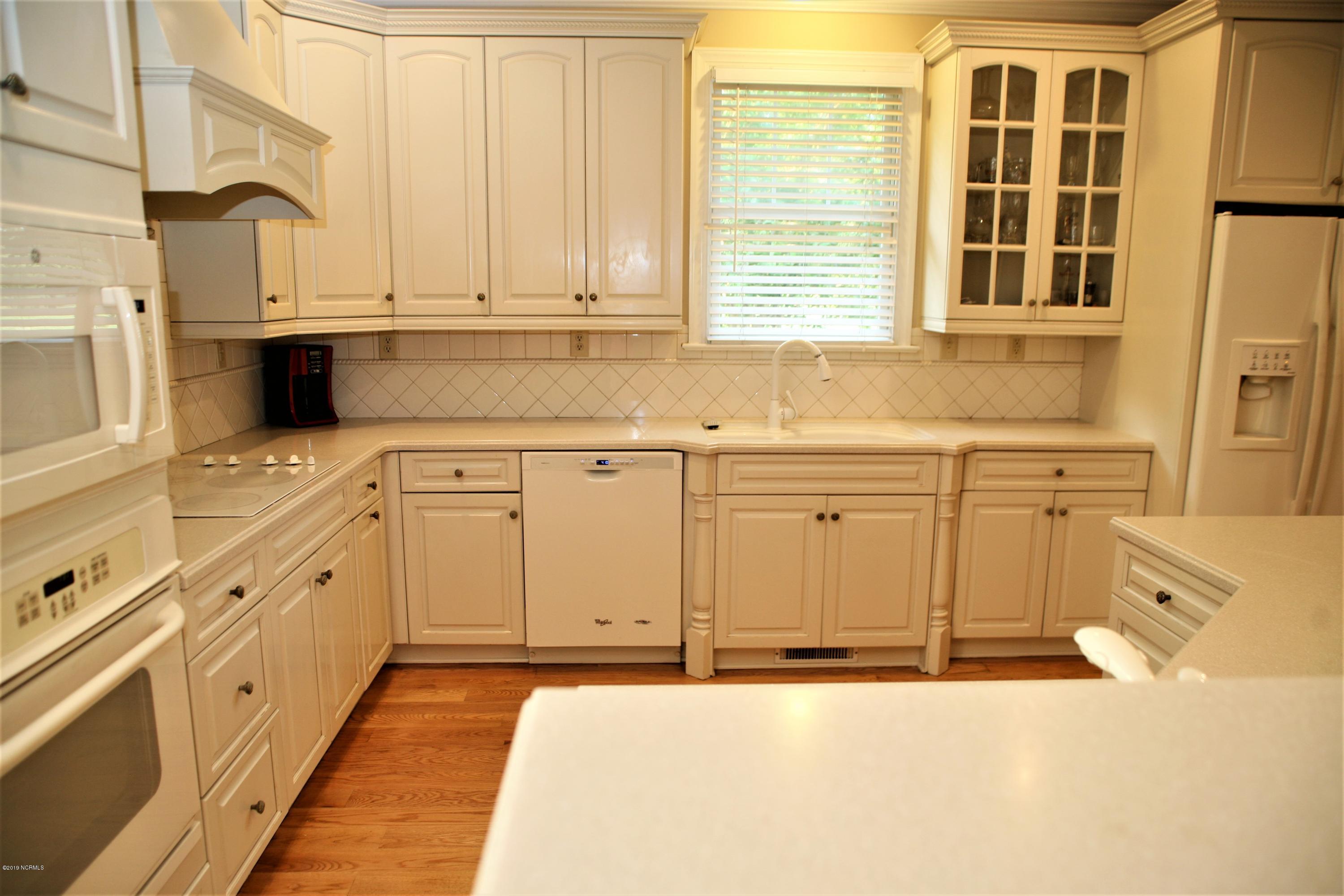 1768 Greens Bridge Road Garland, NC 28441 - Photo 17 of 59 Kitchen with Wine Rack and Wine Fridge