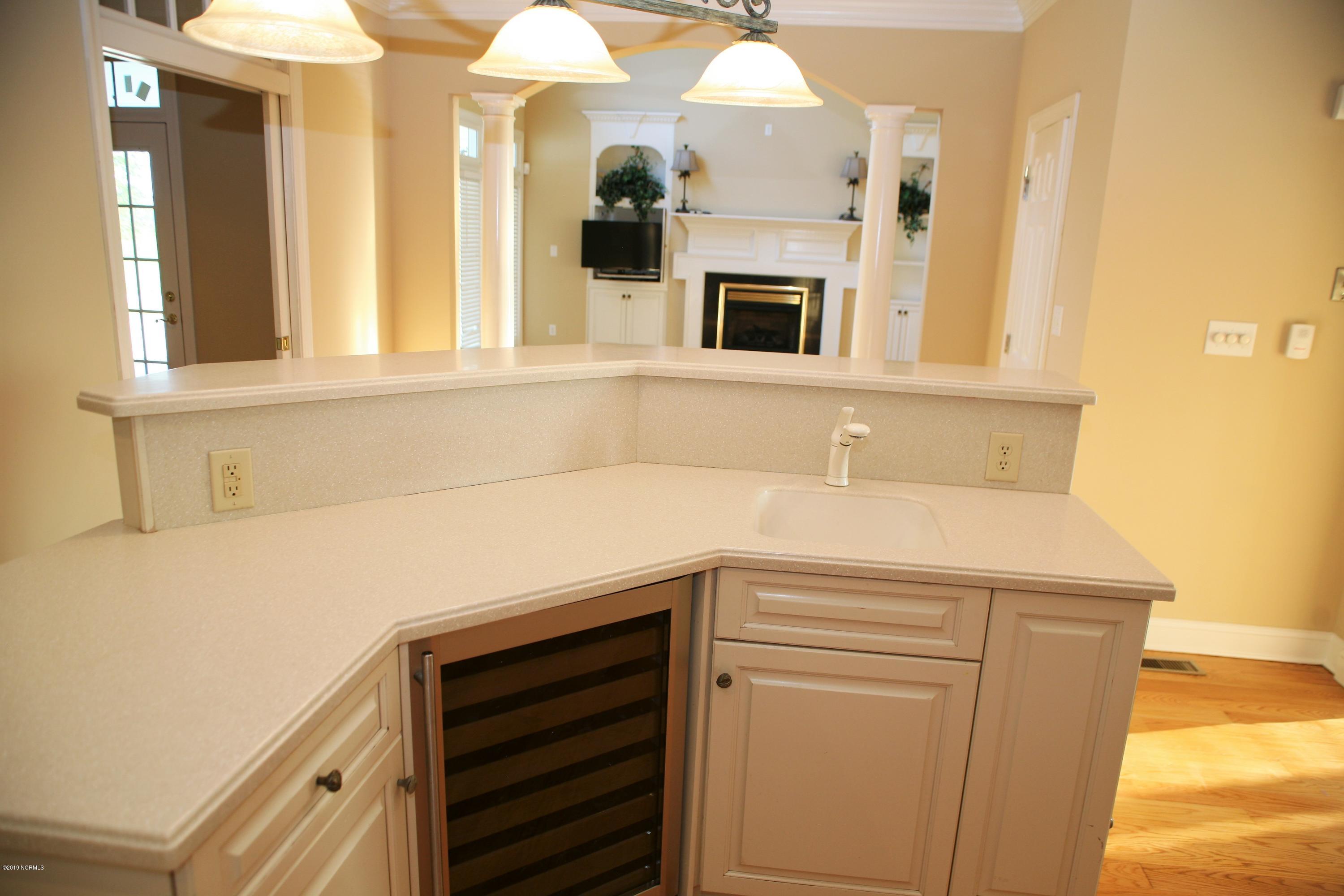 1768 Greens Bridge Road Garland, NC 28441 - Photo 20 of 59 Kitchen with Built In Wine Rack and Bar Prep Sink