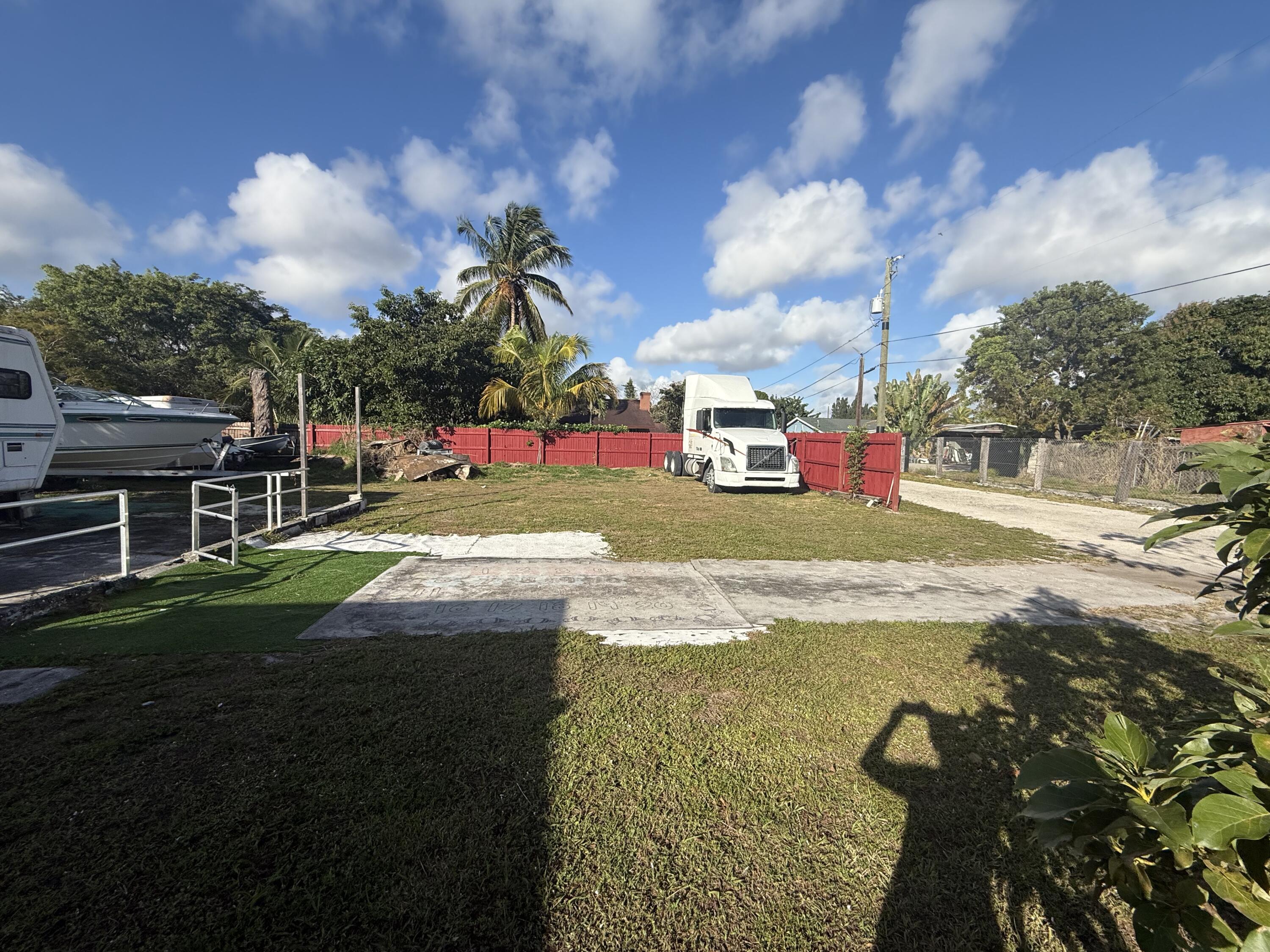 1203 Mathis Street Lake Worth, FL 33461 - Photo 15 of 19 a view of a playground with basketball court