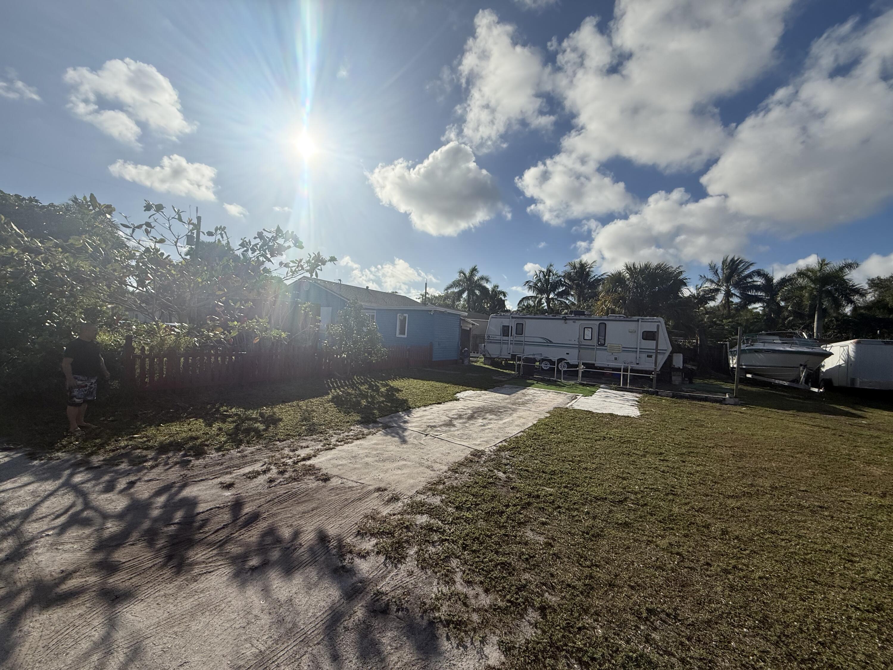 1203 Mathis Street Lake Worth, FL 33461 - Photo 17 of 19 a view of a backyard of the house