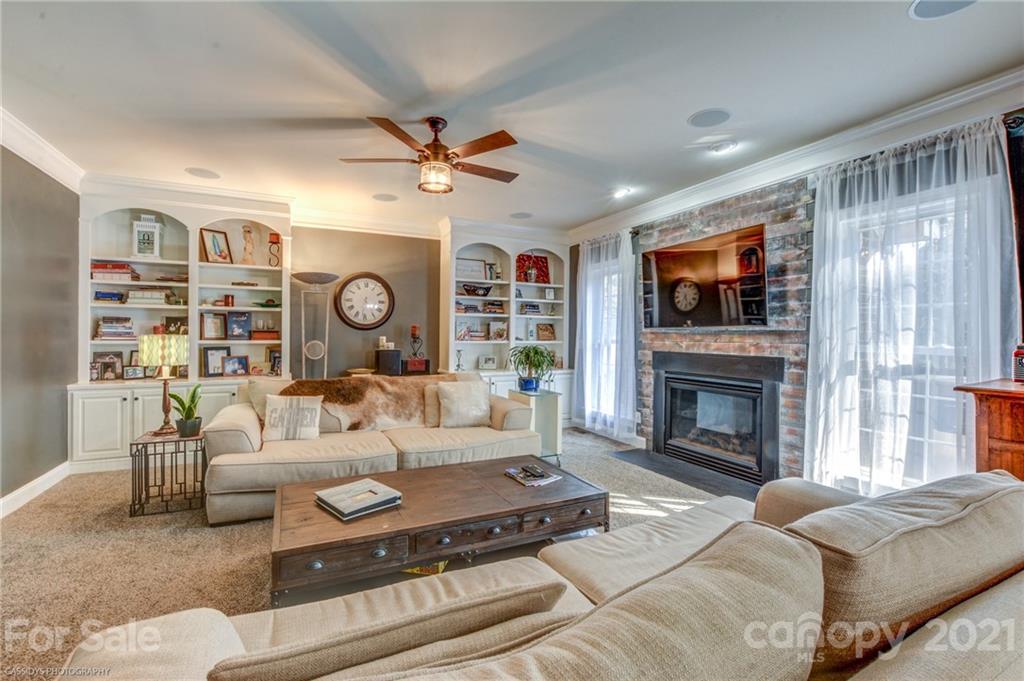 2678 Landing Pointe Drive Clover, SC 29710 - Photo 11 of 48 a living room with furniture a fireplace and a flat screen tv
