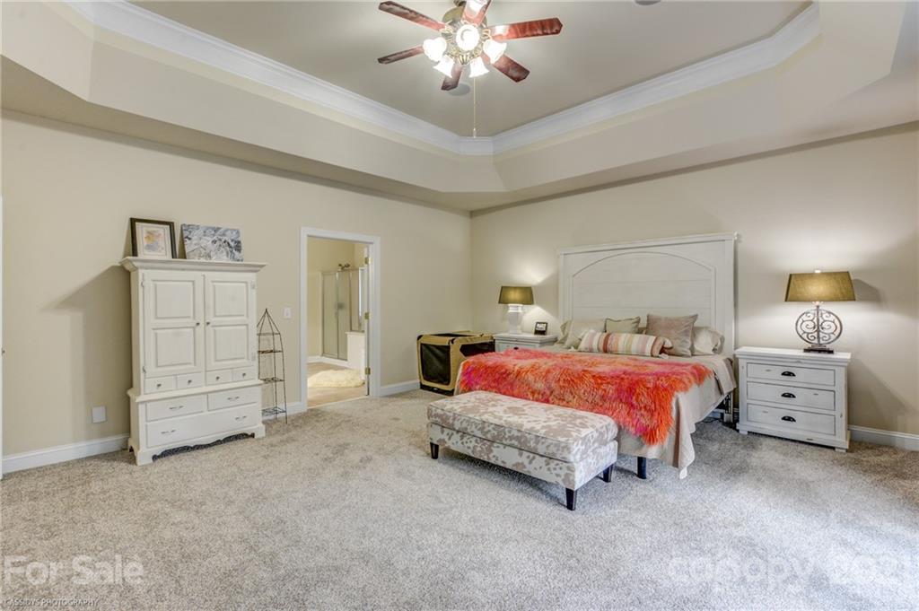 2678 Landing Pointe Drive Clover, SC 29710 - Photo 25 of 48 a spacious bedroom with a bed and dresser