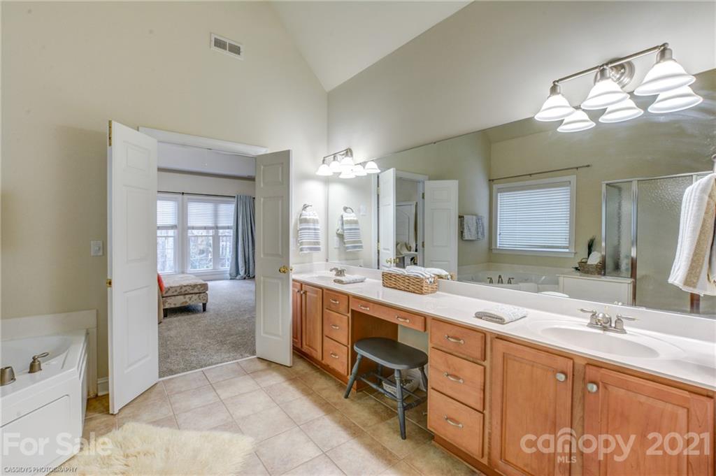 2678 Landing Pointe Drive Clover, SC 29710 - Photo 29 of 48 a large bathroom with a double vanity sink and a mirror