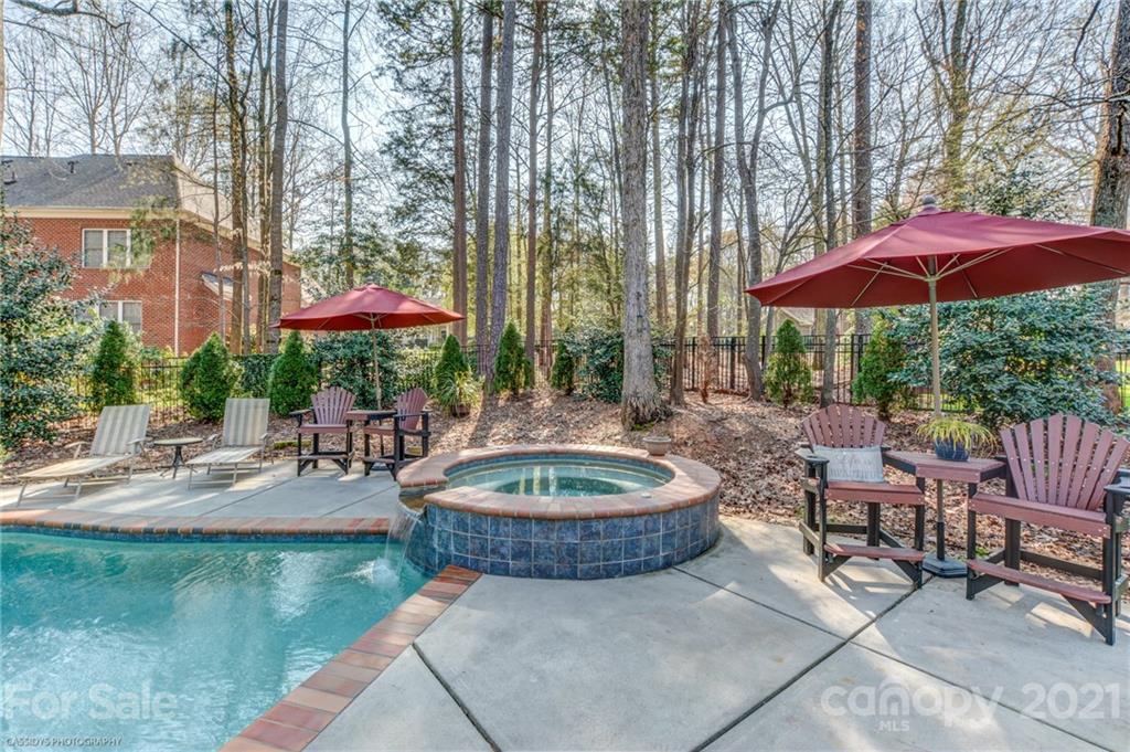2678 Landing Pointe Drive Clover, SC 29710 - Photo 43 of 48 a view of a patio with chairs and tables with a umbrella