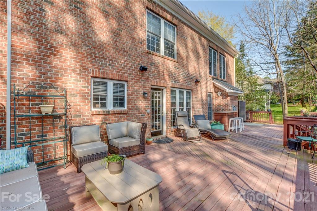2678 Landing Pointe Drive Clover, SC 29710 - Photo 46 of 48 a view of a patio with couches chairs and wooden floor