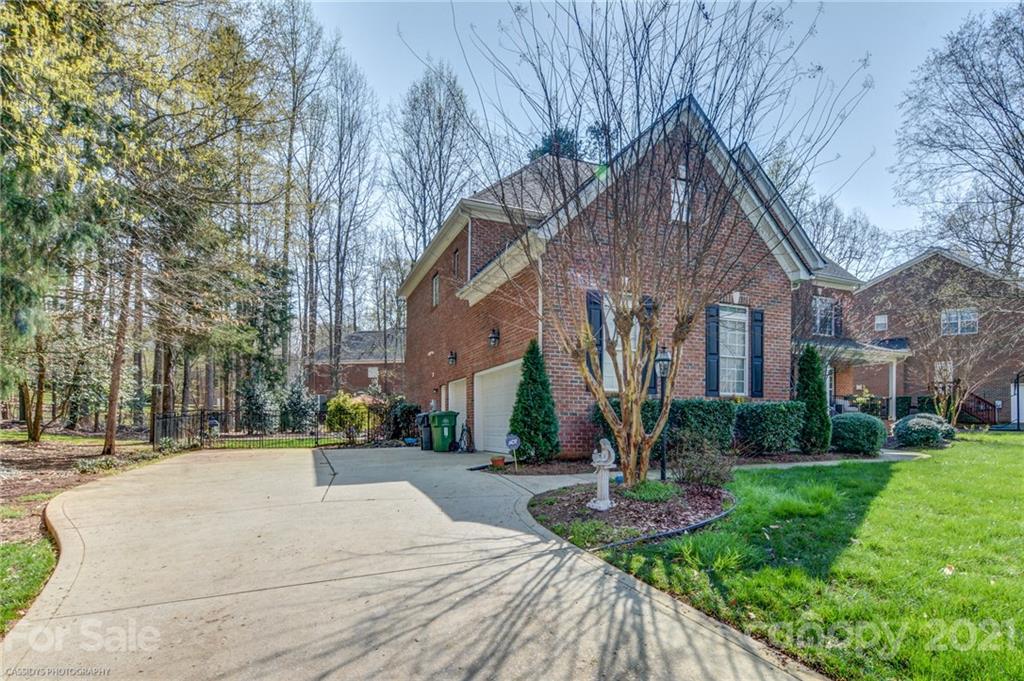 2678 Landing Pointe Drive Clover, SC 29710 - Photo 48 of 48 a front view of a house with garden and trees