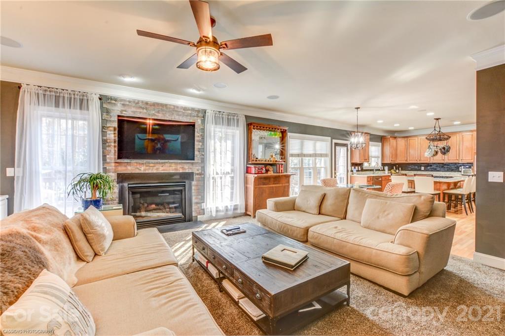 2678 Landing Pointe Drive Clover, SC 29710 - Photo 10 of 48 a living room with furniture fireplace and a flat screen tv