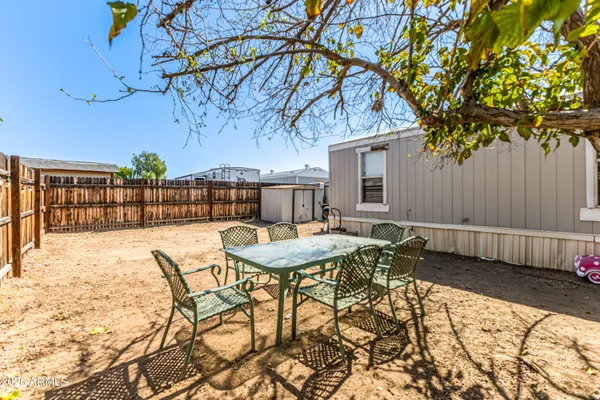 a view of a backyard of the house