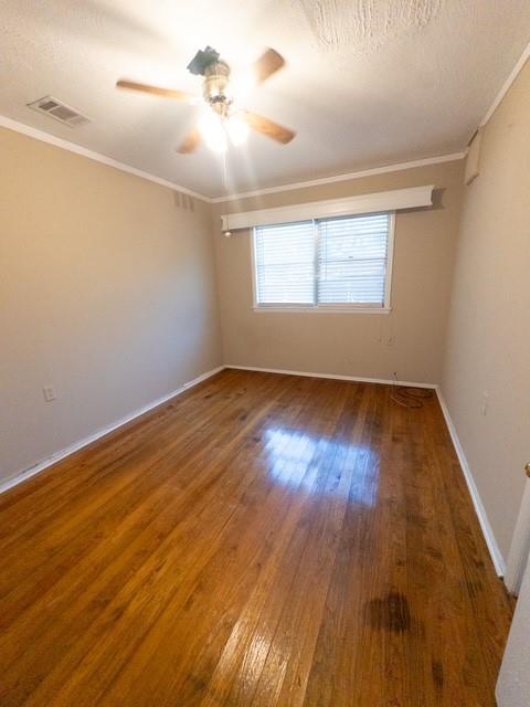613 Laurel Road Athens, TX 75751 - Photo 9 of 13 Hardwood flooring throughout featuring white baseboards, a ceiling fan with light fixture, and a window with horizontal blinds