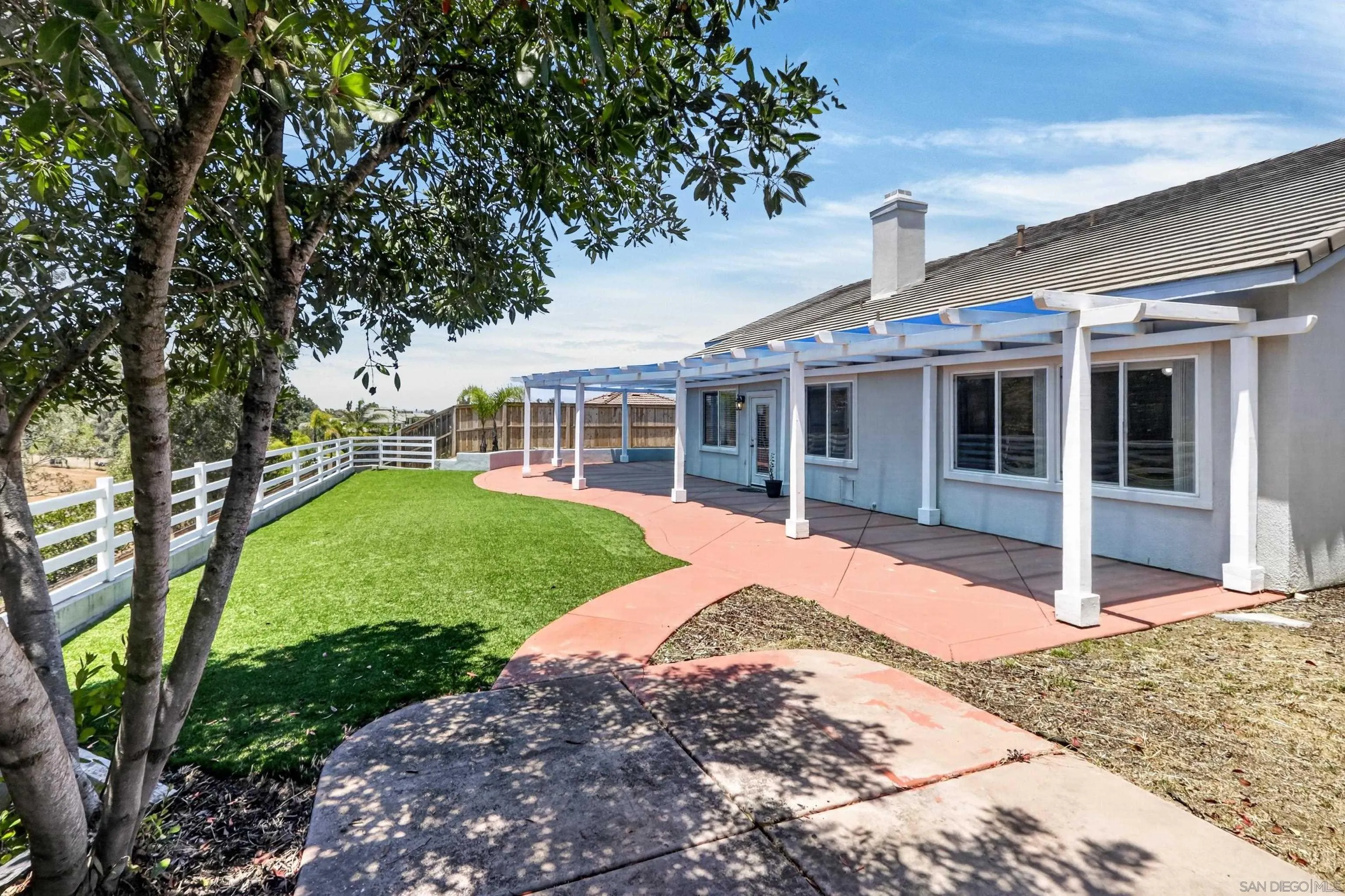 1432 Belmont Park Road Oceanside, CA 92057 - Photo 8 of 54 a front view of a house with a yard