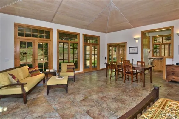 a view of a dining room with furniture window and outside view