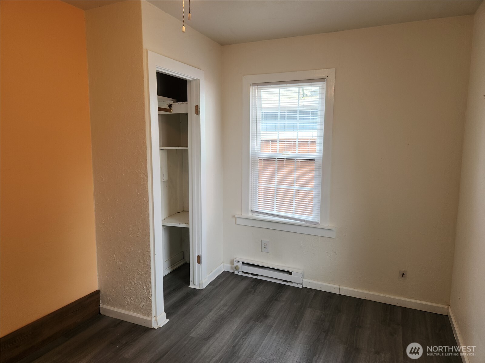 2902 Dover Street Longview, WA 98632 - Photo 23 of 23 an empty room with wooden floor cabinet and window