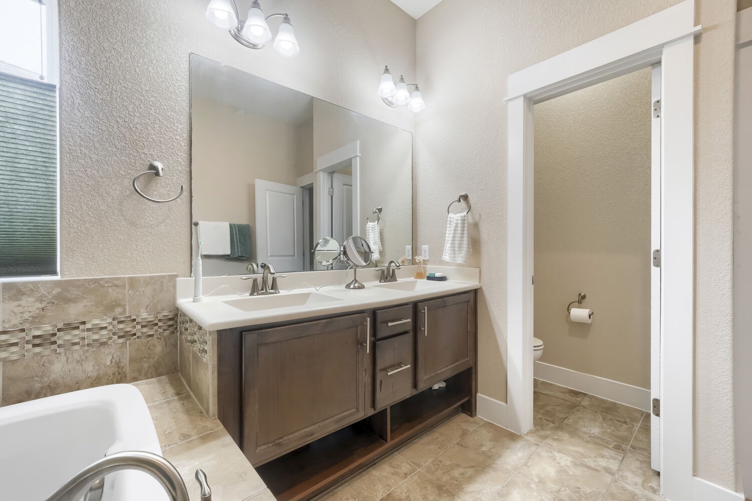 805 Waterfall Way Austin, TX 78753 - Photo 22 of 29 Primary Bathroom with double vanities