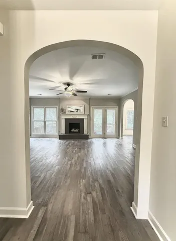 a view of entryway and hall with wooden floor