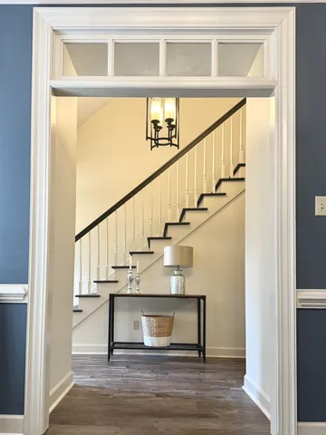 a living room with furniture fireplace and window