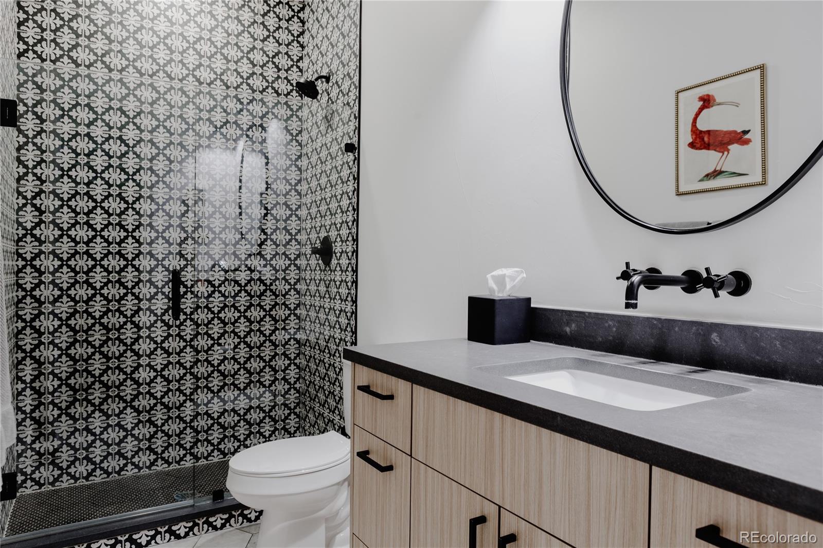 2645 Eudora Street Denver, CO 80207 - Photo 20 of 40 a bathroom with a sink and a mirror