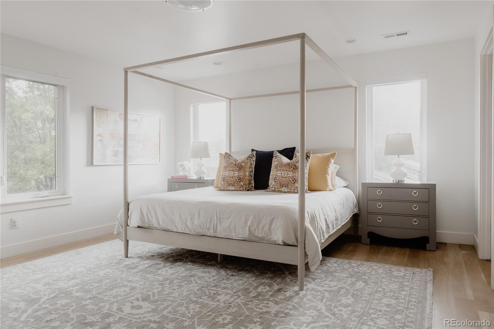 2645 Eudora Street Denver, CO 80207 - Photo 22 of 40 a bedroom with a bed and a window