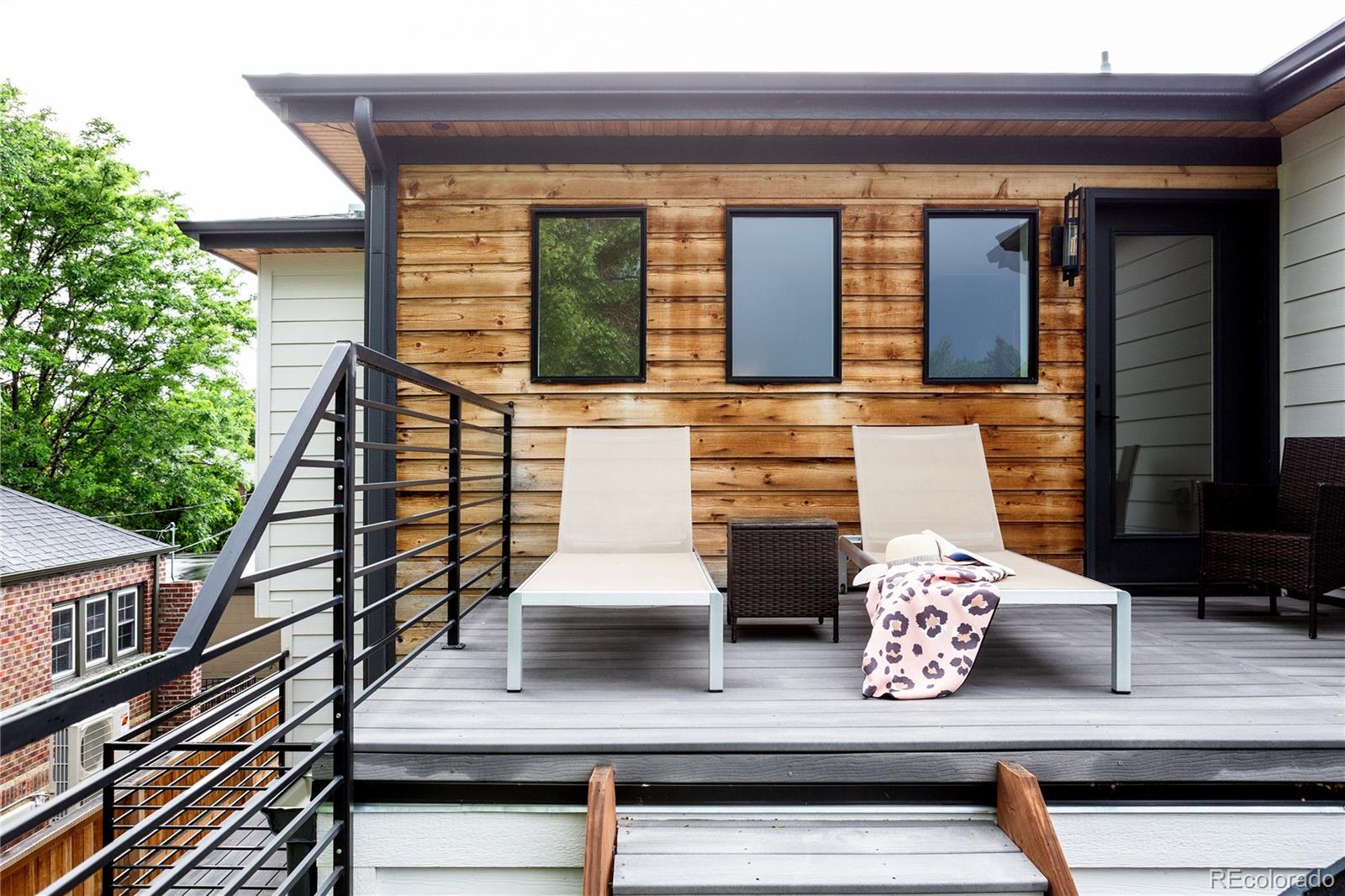2645 Eudora Street Denver, CO 80207 - Photo 28 of 40 a view of house with wooden floor and windows