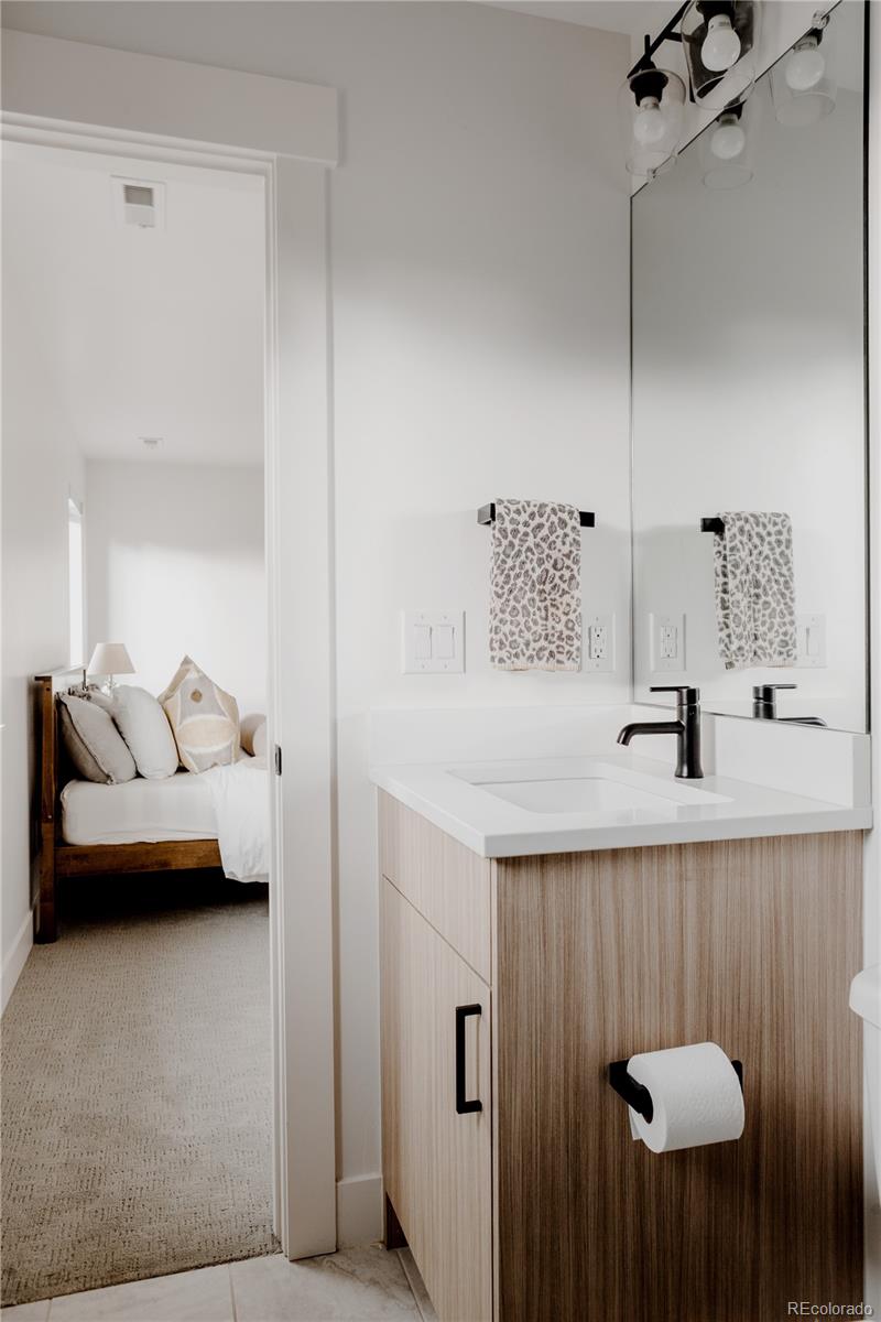 2645 Eudora Street Denver, CO 80207 - Photo 33 of 40 a en suite bathroom with a toilet