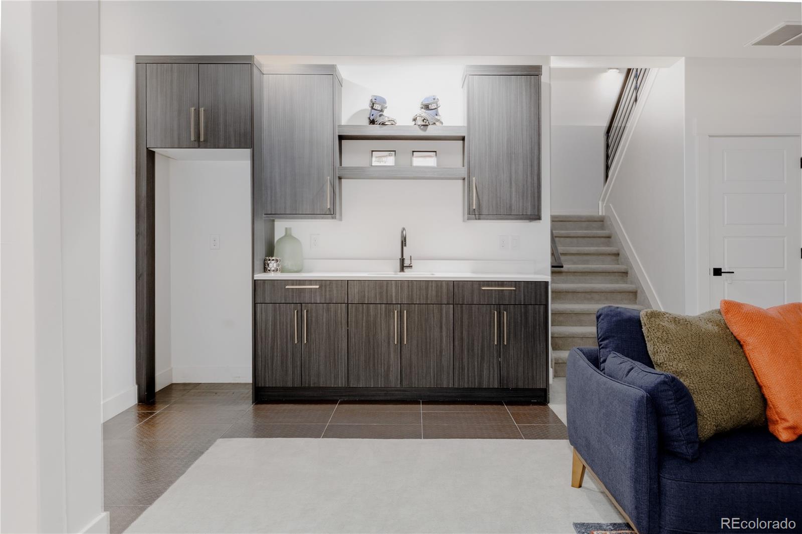 2645 Eudora Street Denver, CO 80207 - Photo 36 of 40 a living room with furniture and a painting