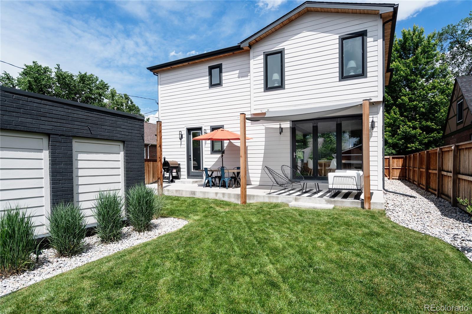 2645 Eudora Street Denver, CO 80207 - Photo 39 of 40 a view of a house with backyard and sitting area