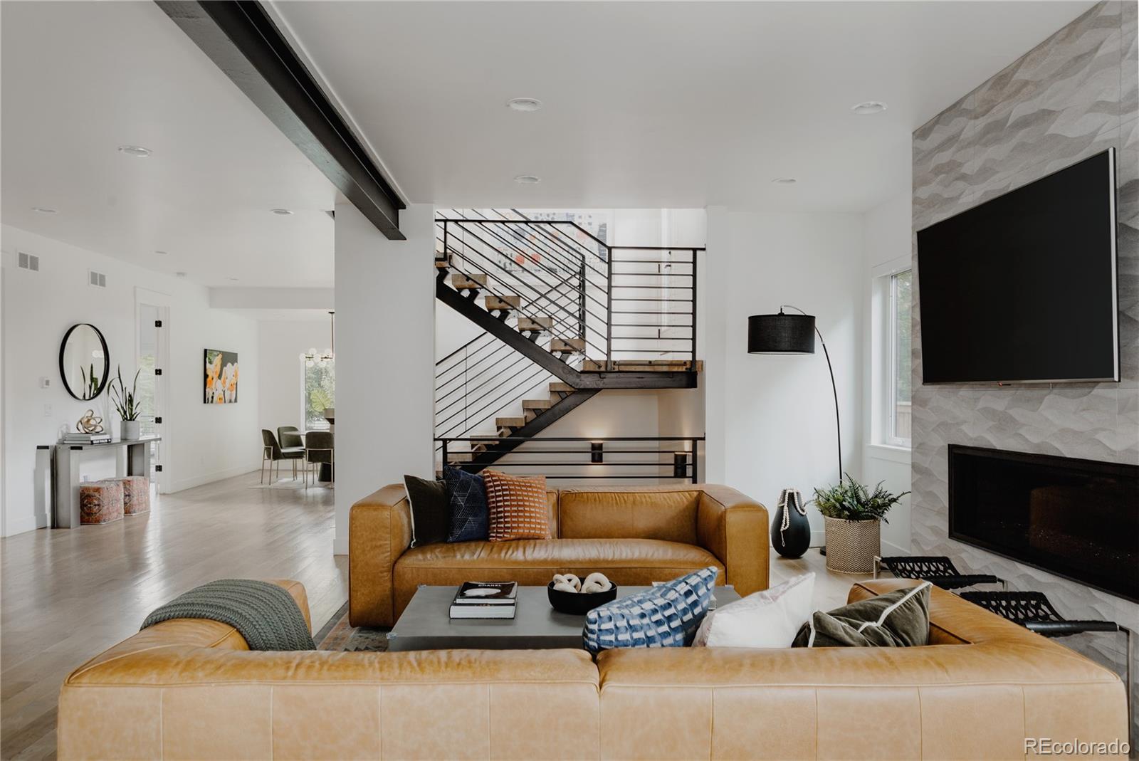 2645 Eudora Street Denver, CO 80207 - Photo 6 of 40 a living room with furniture fireplace and flat screen tv