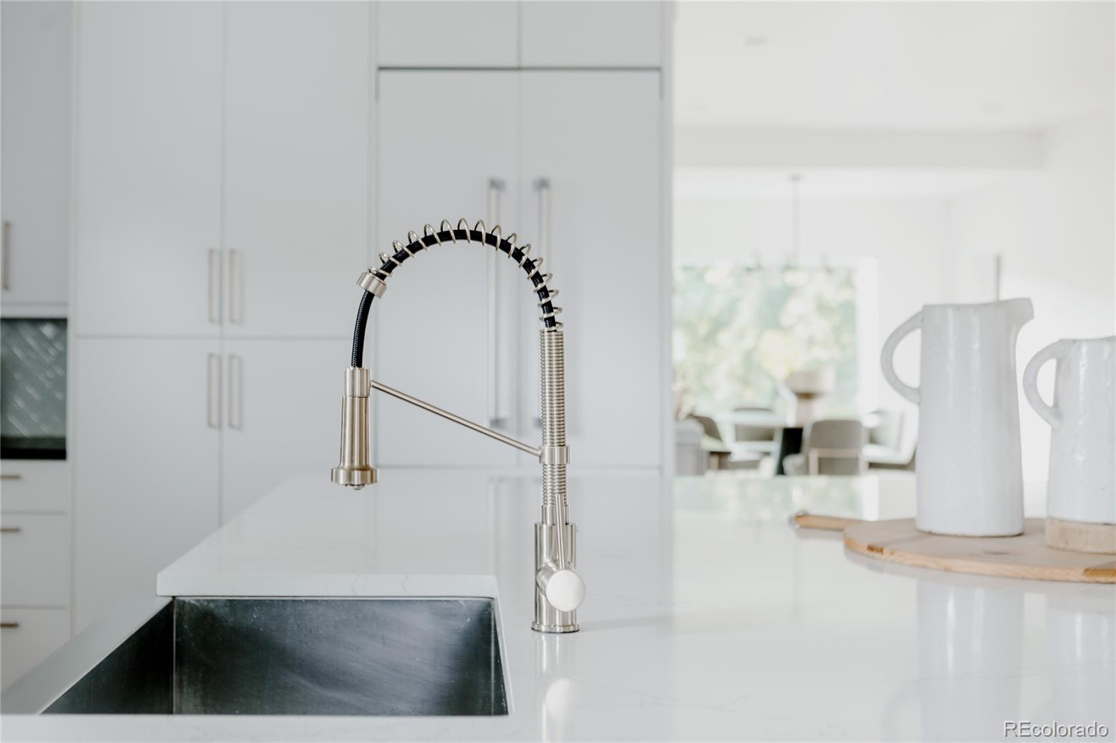 2645 Eudora Street Denver, CO 80207 - Photo 10 of 40 a bathroom with a sink and a mirror