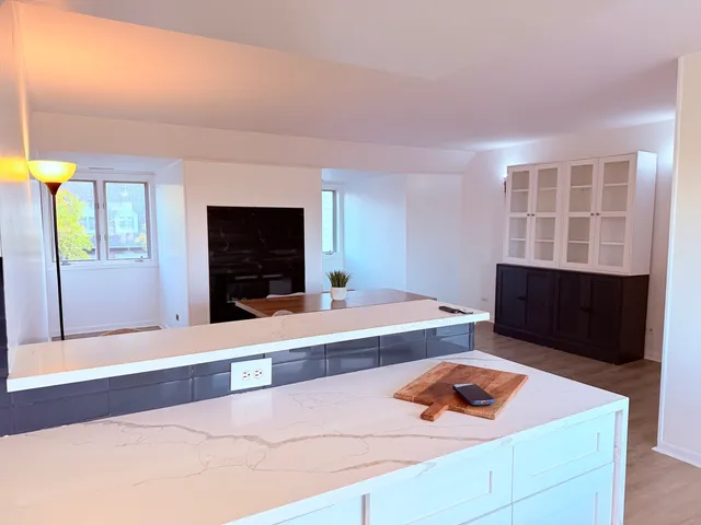 a view of a dining room with furniture and a window