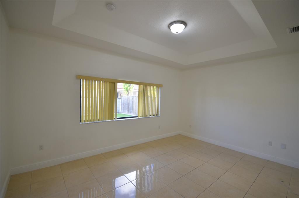 14483 Southwest 13th Terrace Miami, FL 33184 - Photo 11 of 27 an empty room with a empty space and windows
