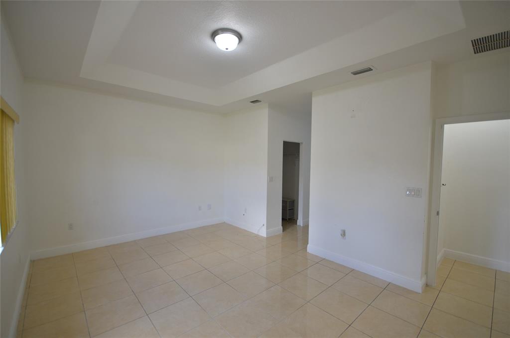 14483 Southwest 13th Terrace Miami, FL 33184 - Photo 12 of 27 an empty room with an entryway