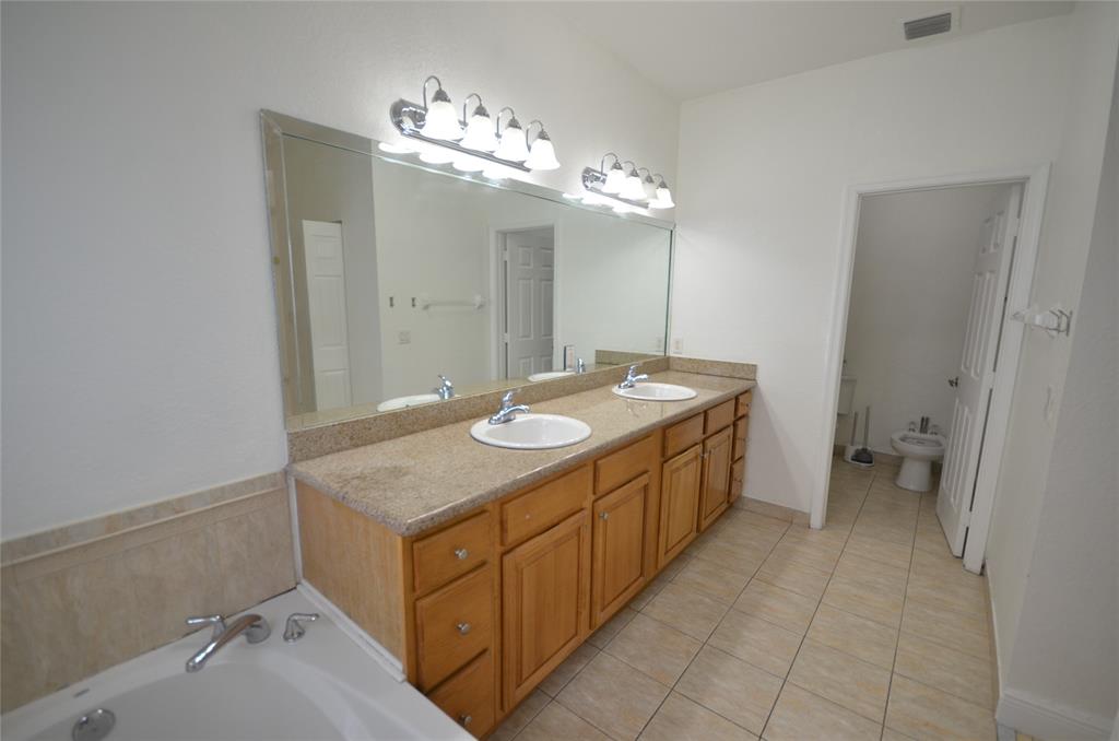 14483 Southwest 13th Terrace Miami, FL 33184 - Photo 14 of 27 a bathroom with a sink a vanity and a mirror