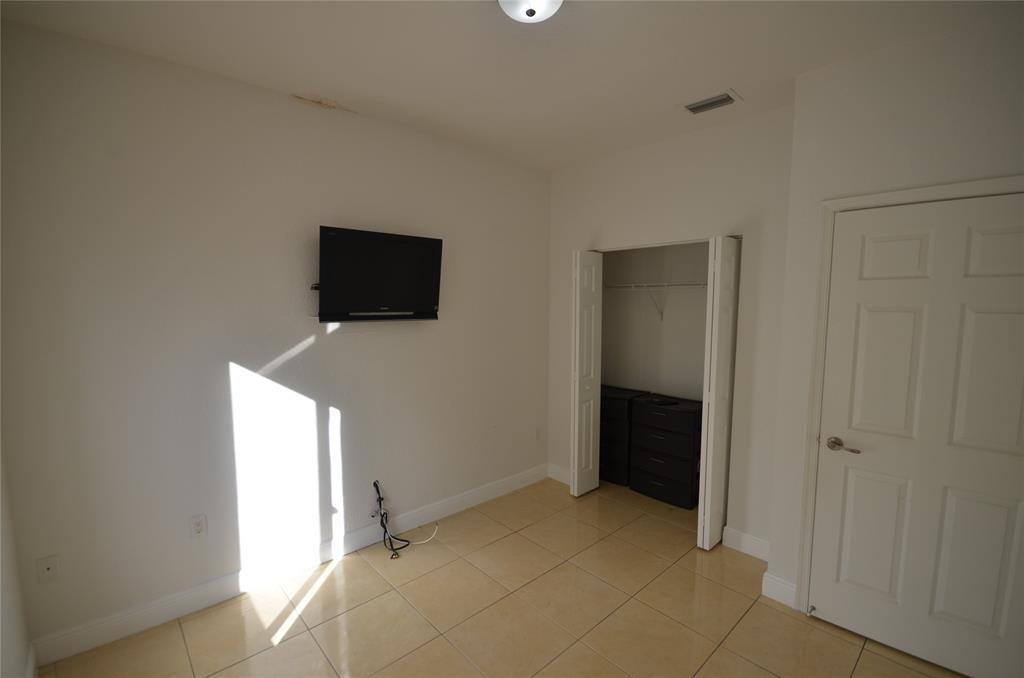 14483 Southwest 13th Terrace Miami, FL 33184 - Photo 21 of 27 a view of a livingroom with a flat screen tv