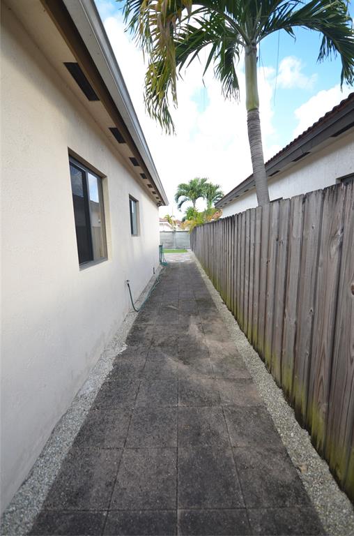 14483 Southwest 13th Terrace Miami, FL 33184 - Photo 25 of 27 a view of a house with a backyard